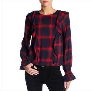 Cute plaid ruffle top with ruffle sleeve.